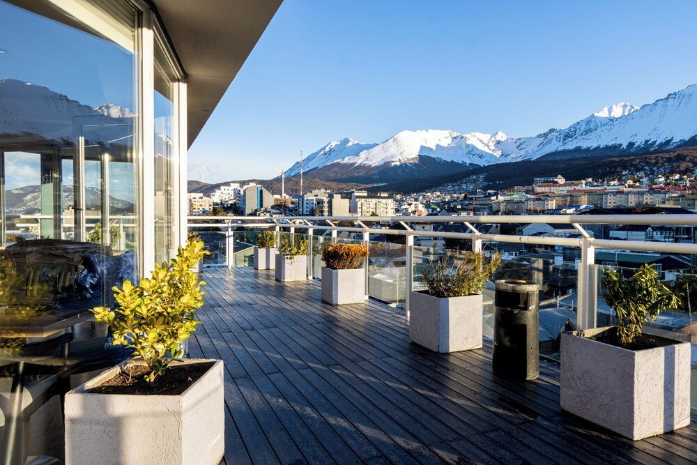 Deck with potted plants and a view over the town