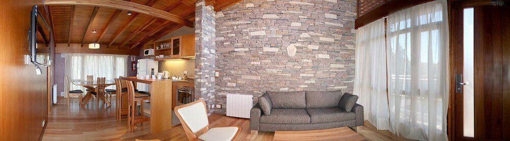 Cosy living area with a stone wall in an apartment