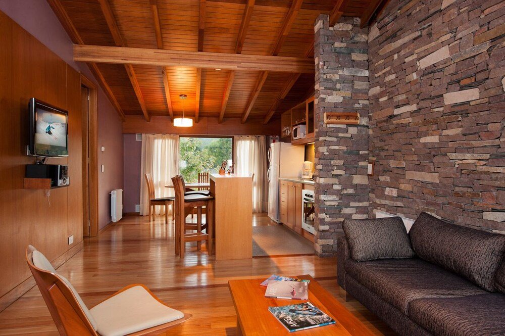 Living room with a wooden ceiling and comfortable seating
