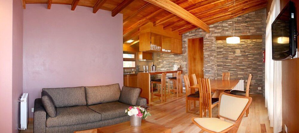 Living area with a sofa and dining table in an apartment