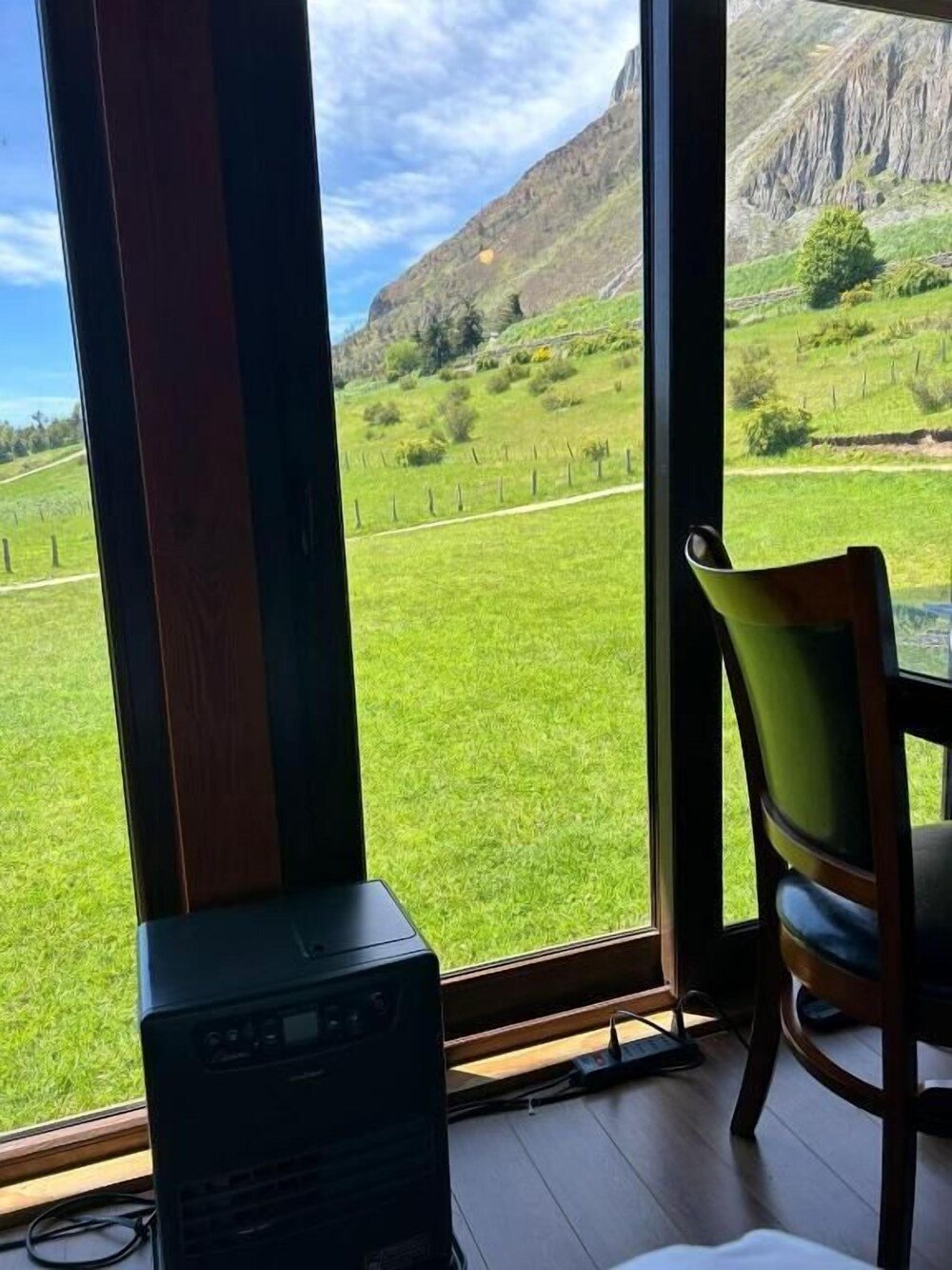 Guest room with a large window at the lodge