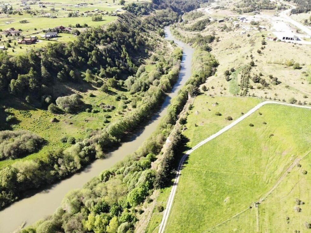 Aerial view of a river winding through the valley