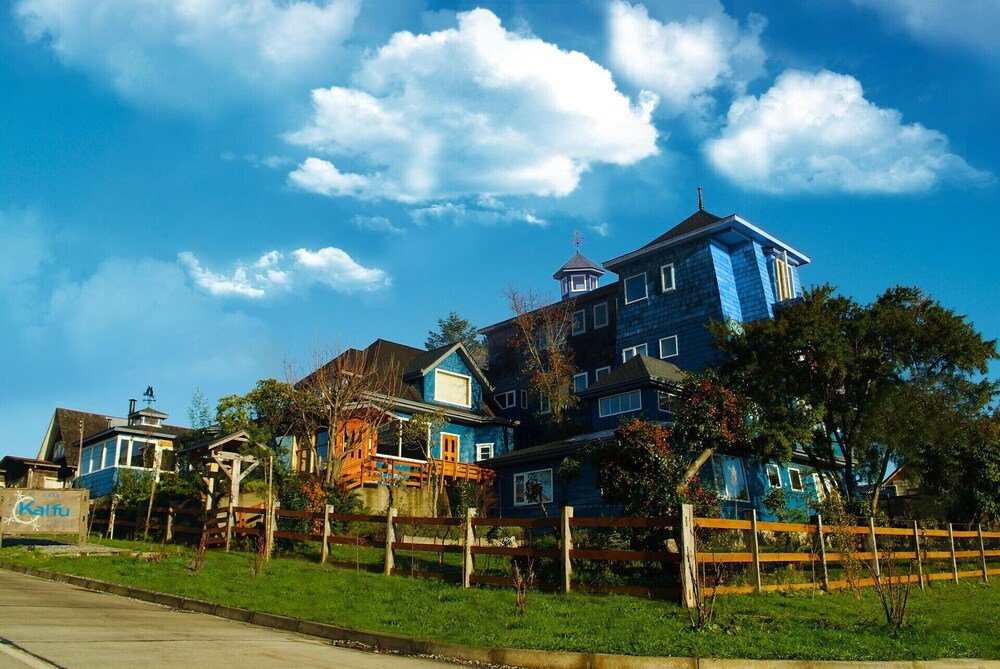 Large multi-story building housing Casa Kalfu in Puerto Varas