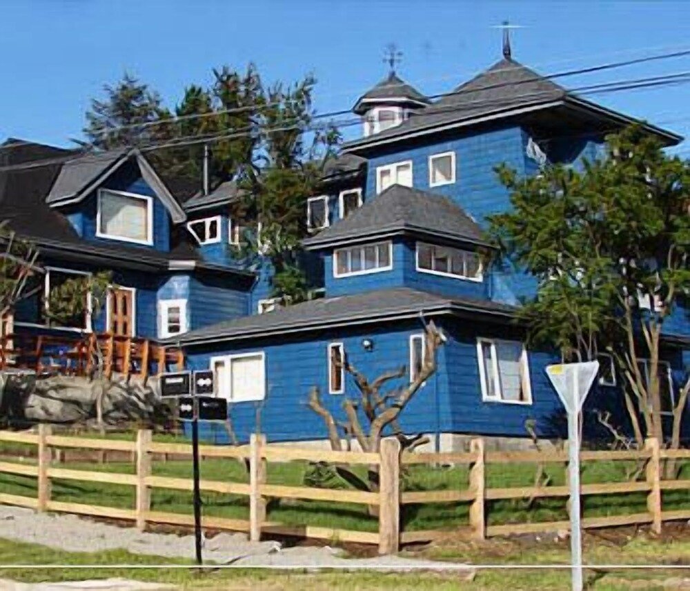 Two-story house with a dark facade at the hotel