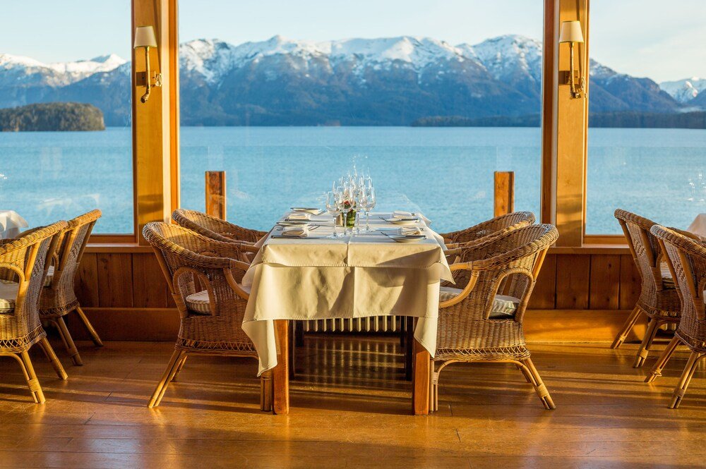 Dining table set for four with wine glasses