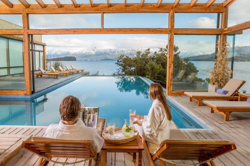 Couple seated at a wooden table at Correntoso Lake & River Hotel