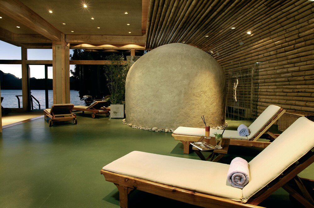 Spa area with wooden loungers at Correntoso Lake & River Hotel