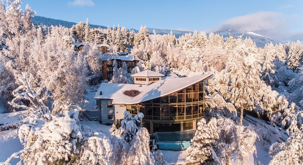 Modern building surrounded by snow at Design Suites Bariloche