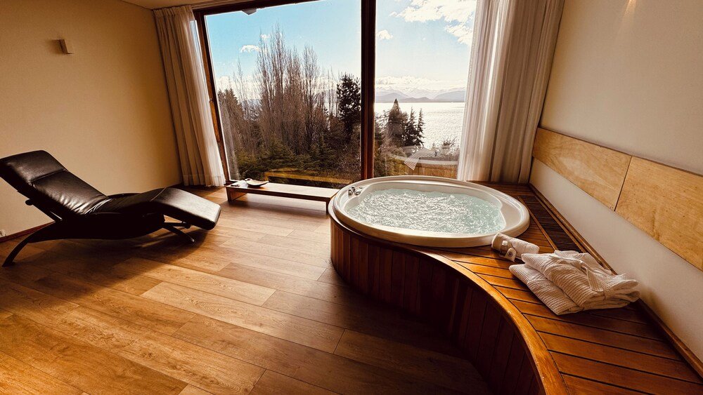 Spa room with a wooden floor at Design Suites Bariloche