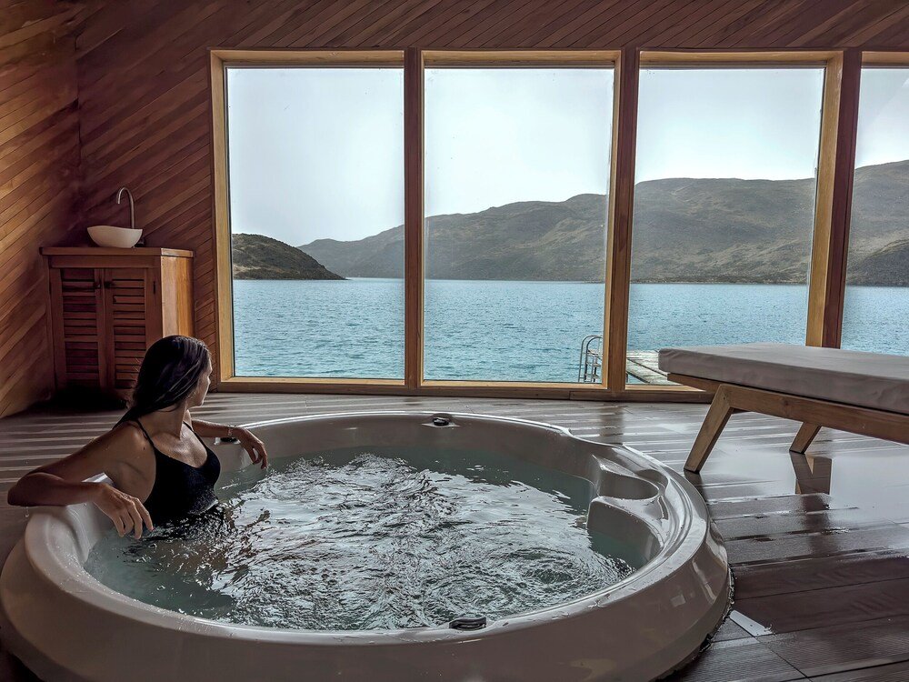 Woman in a bathtub with a view