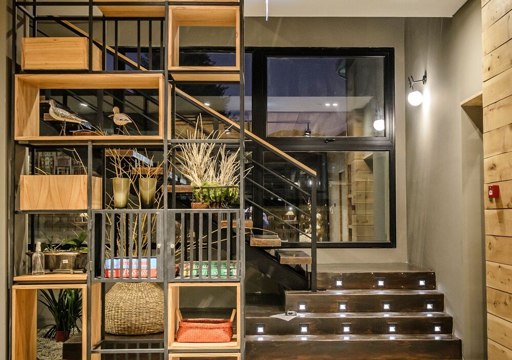 Modern interior with a wooden staircase at Gluck Patagonia Aparts