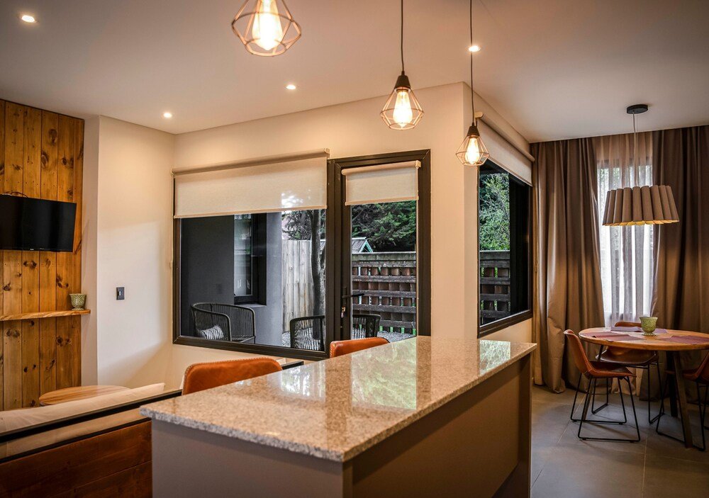 Modern kitchen with a large island at Gluck Patagonia Aparts