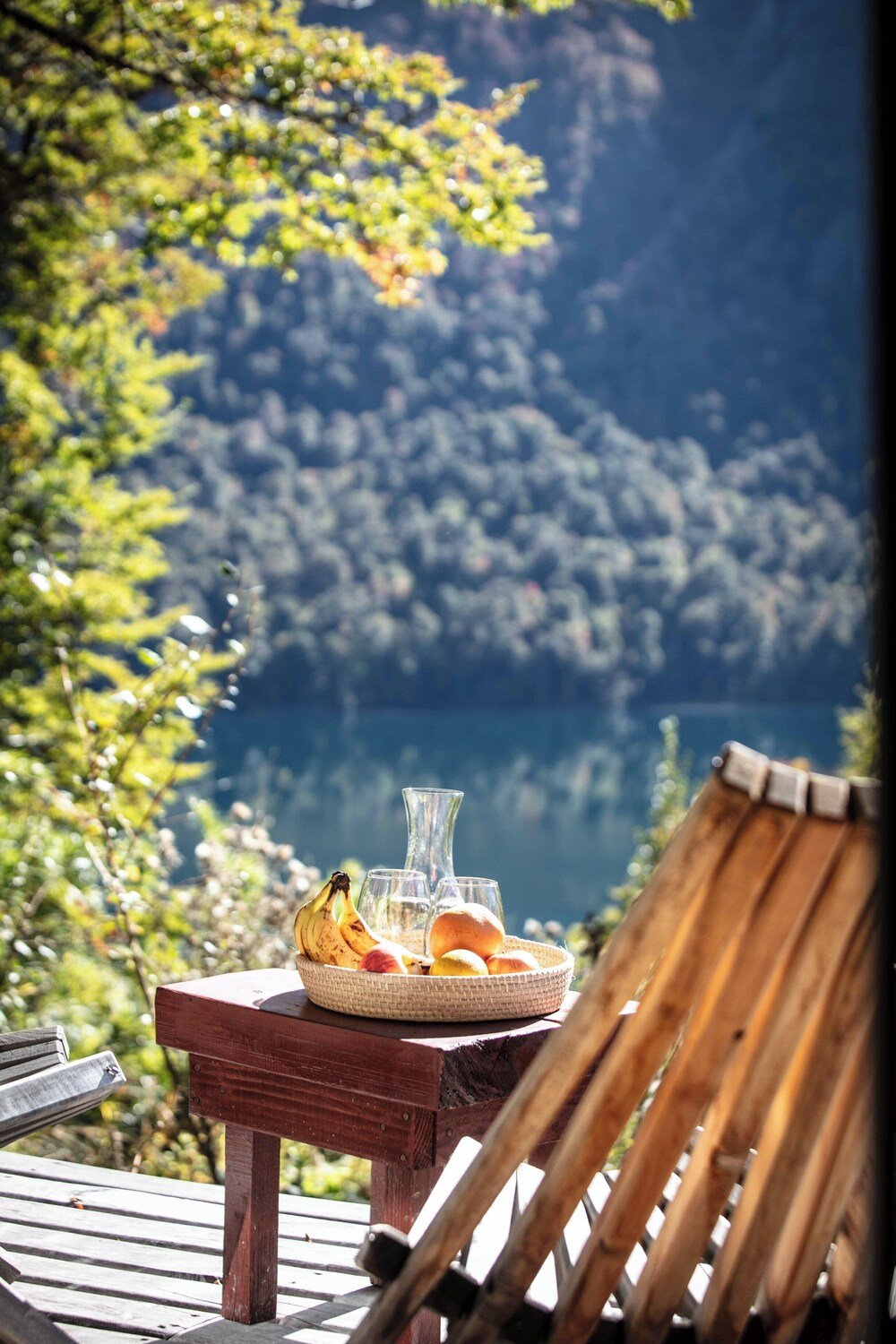 Wooden table with a basket of fresh fruit inside the lodge