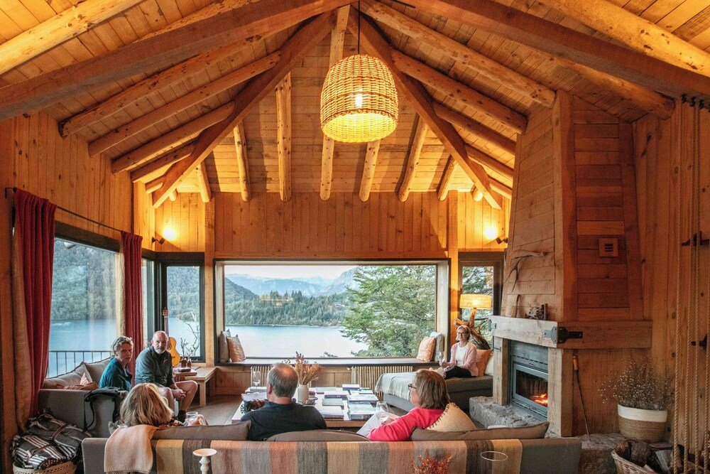Wooden cabin-style living space with a fireplace at the lodge