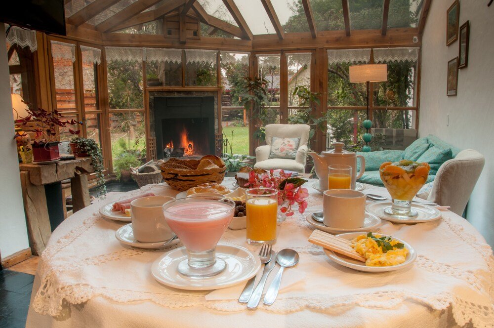 Breakfast table set with a variety of dishes and drinks