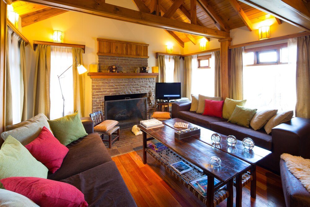 Cozy living room with a fireplace and wooden beams