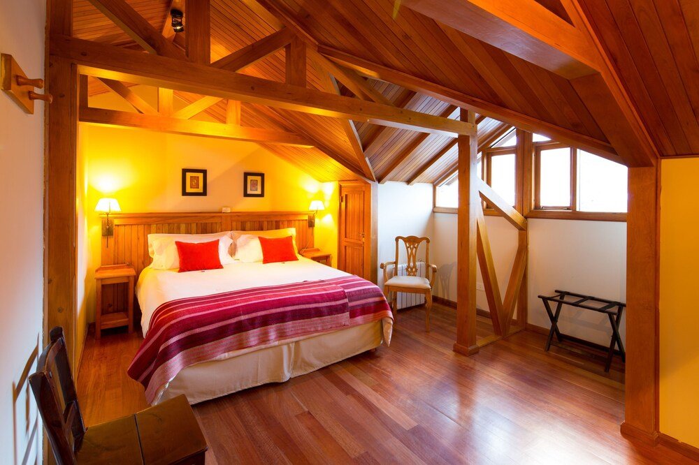 Bedroom with a wooden ceiling