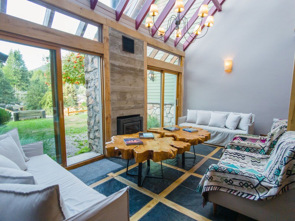 Cozy room with a fireplace, a sofa and a coffee table