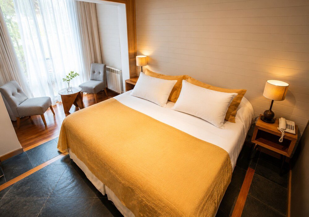 Another comfortable guest room at the inn with simple, warm decor