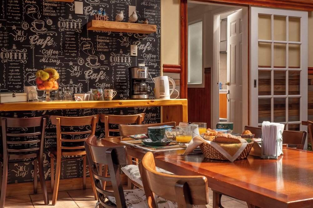 Cozy café area with a chalkboard wall inside the hotel
