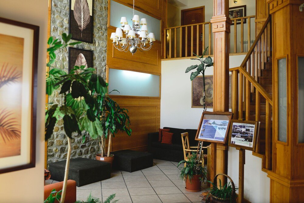 Lobby with a stone wall and a chandelier