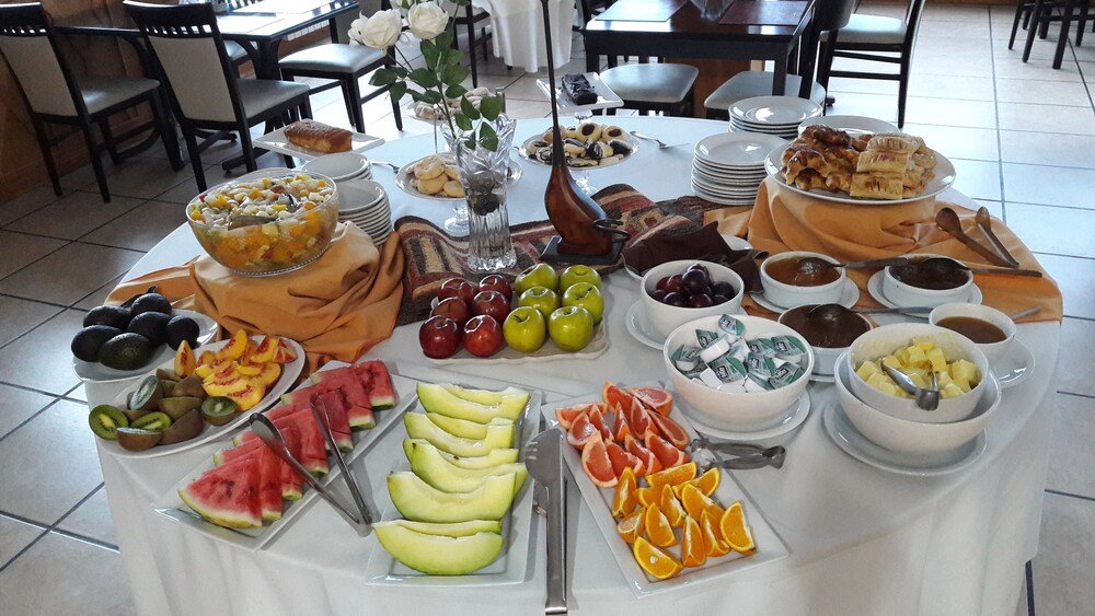 Buffet table with fruit and pastries