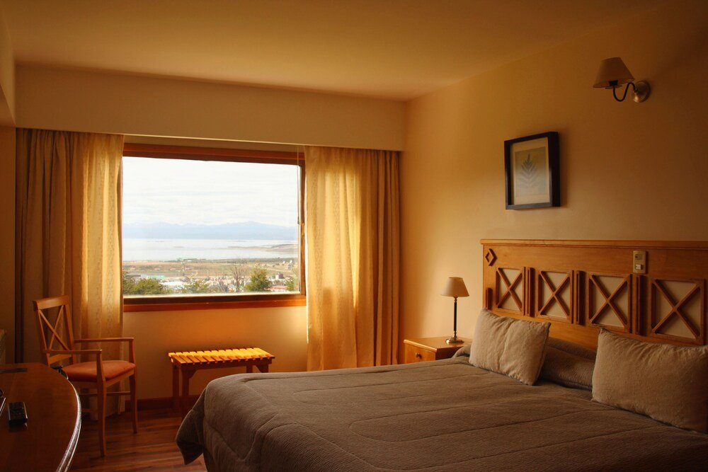 Hotel room with a large bed and a desk