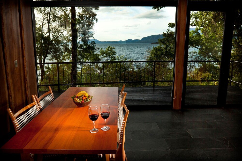 Wooden dining table set up at the restaurant of Hotel Antumalal