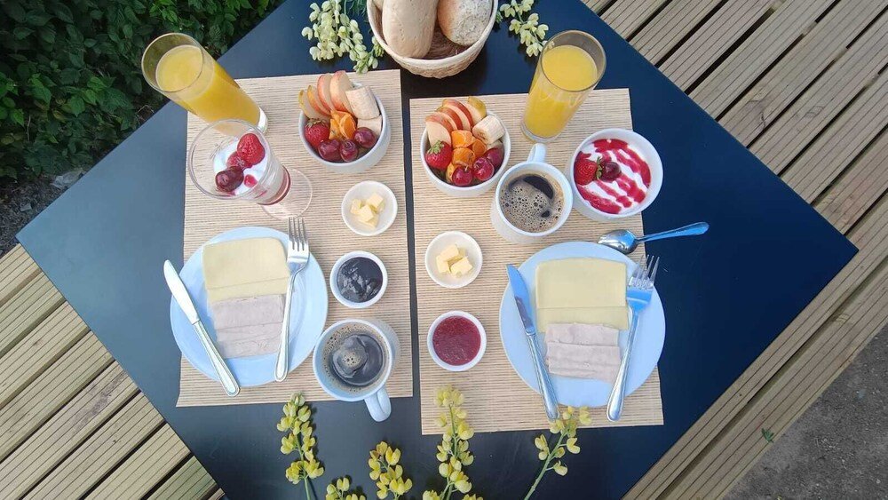 Two dining tables set with a breakfast spread