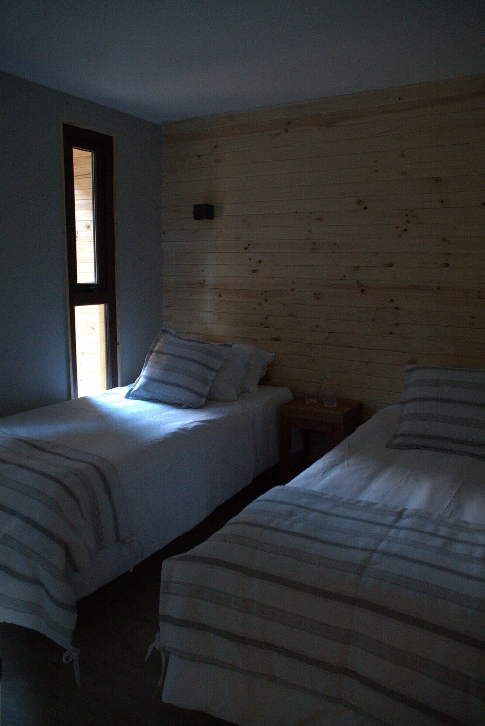Guest room with two beds at Hotel Bacaris in town