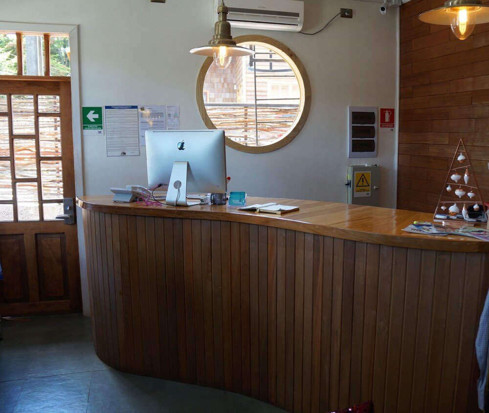 Reception desk with a computer at the hotel entrance