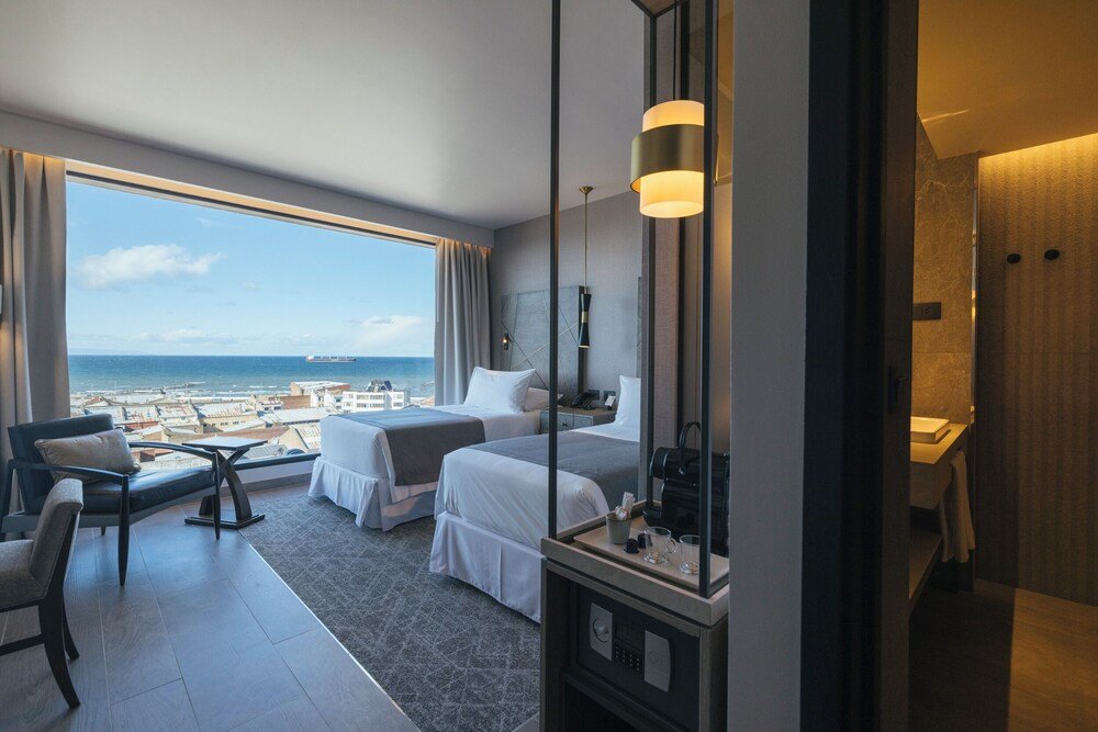 Hotel room with a large window at Hotel Cabo de Hornos