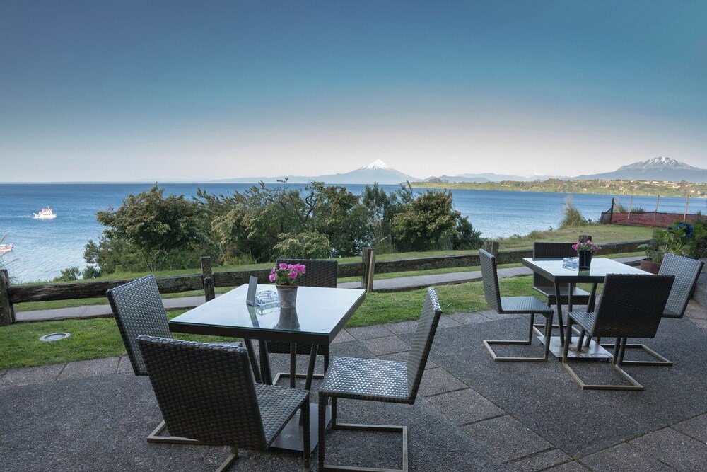 Outdoor patio with tables at the lakeside hotel