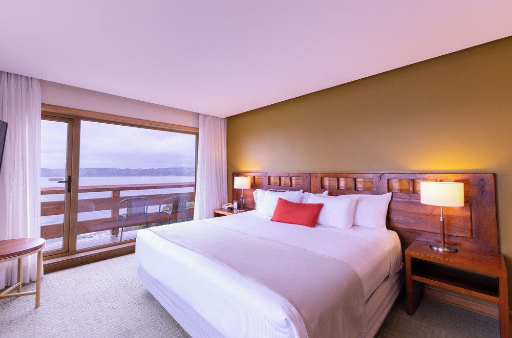 Hotel room with a large bed and soft lighting