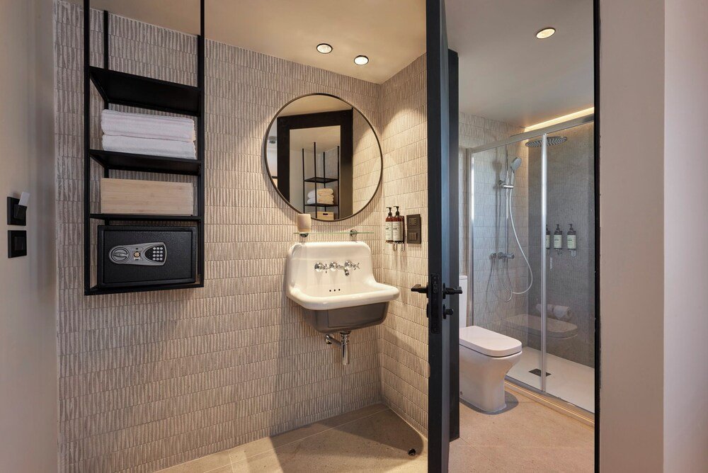 Modern bathroom with a built-in sink and a round mirror