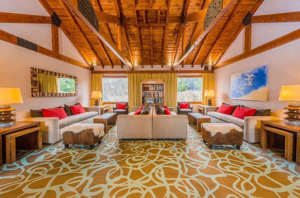 Spacious living area with a high wooden ceiling