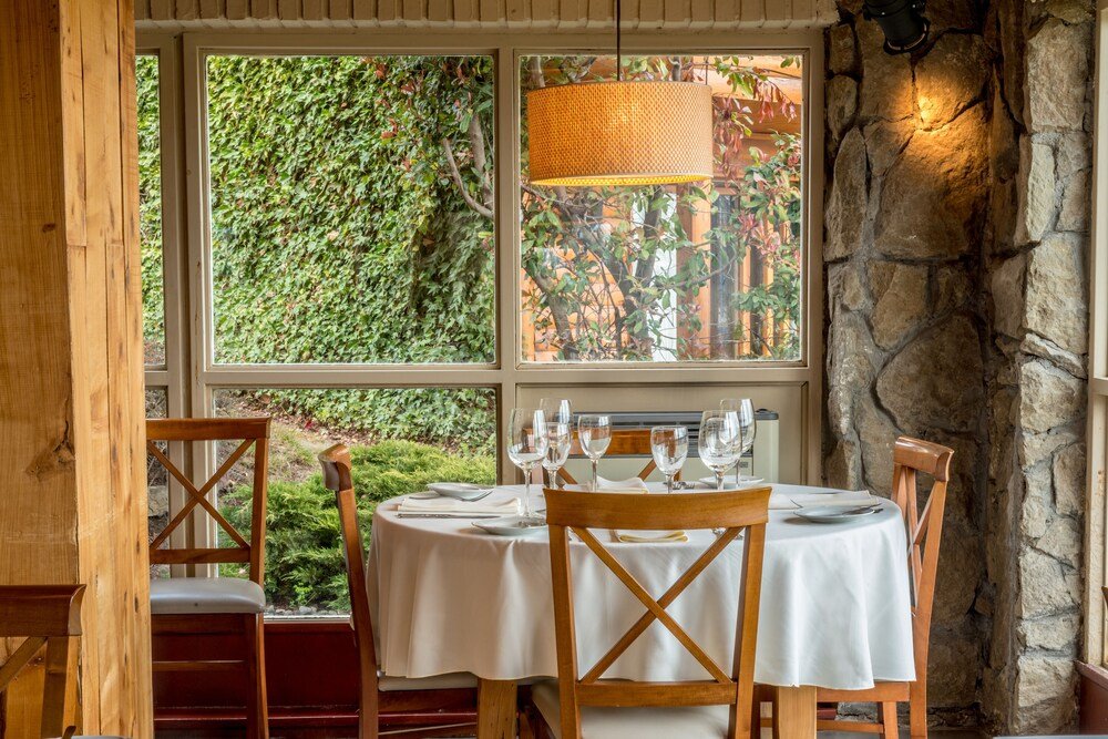 Dining area with a round table set for four