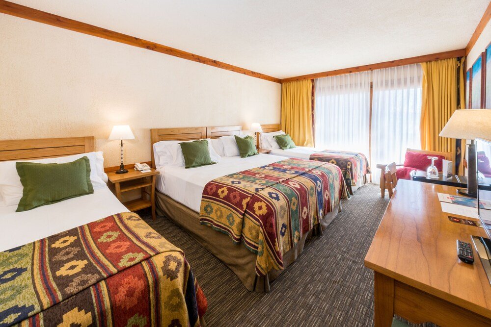 Hotel room with three beds