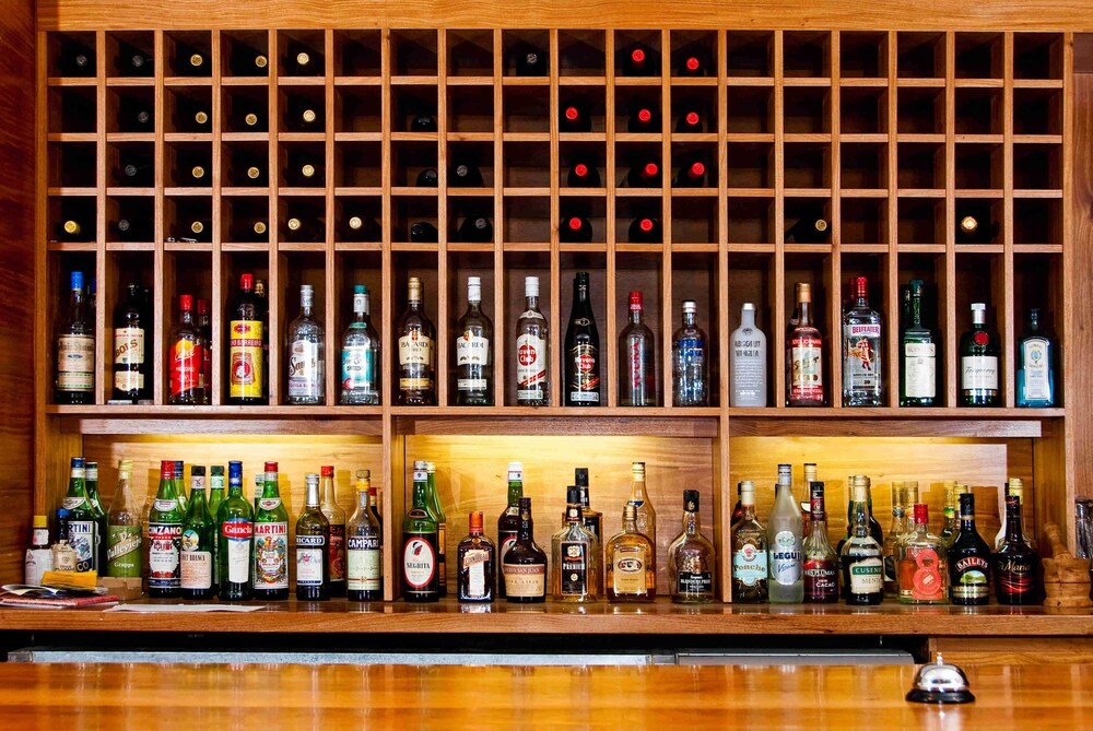 Bar with a wooden wine rack at the hotel