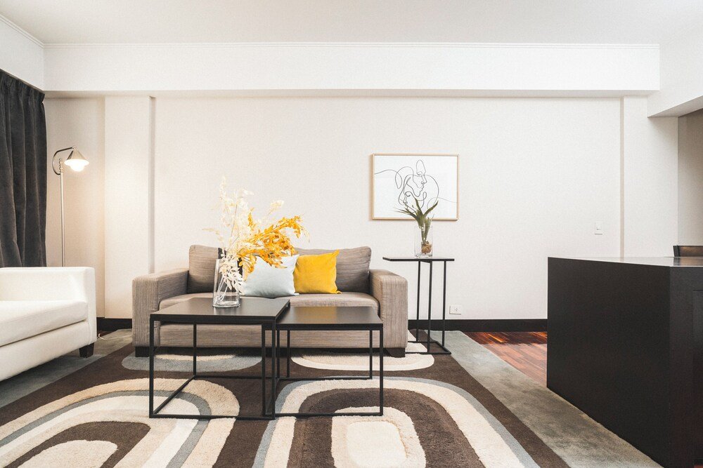 Modern living room with a sofa and two coffee tables