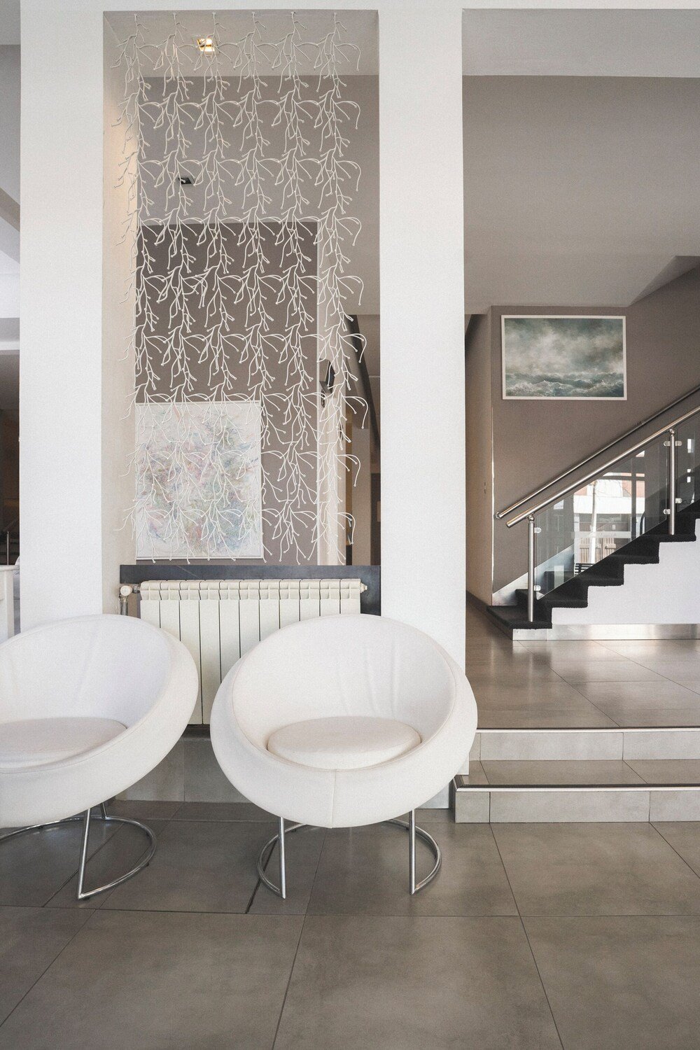 Modern interior with two white chairs and a table