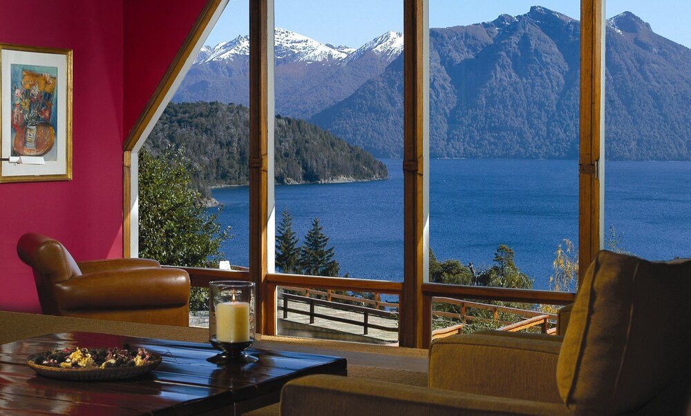 Hotel room with a large window overlooking the lake