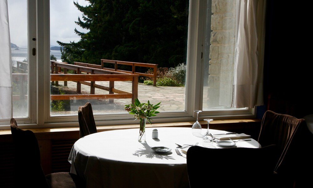 Dining table with a white tablecloth in the restaurant