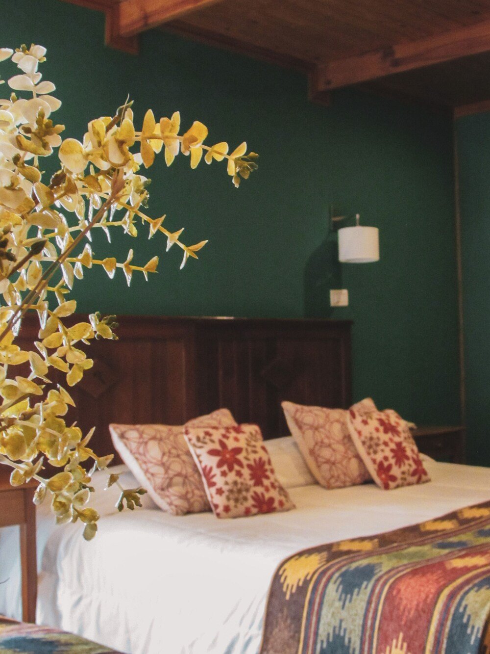 Bedroom with a wooden headboard