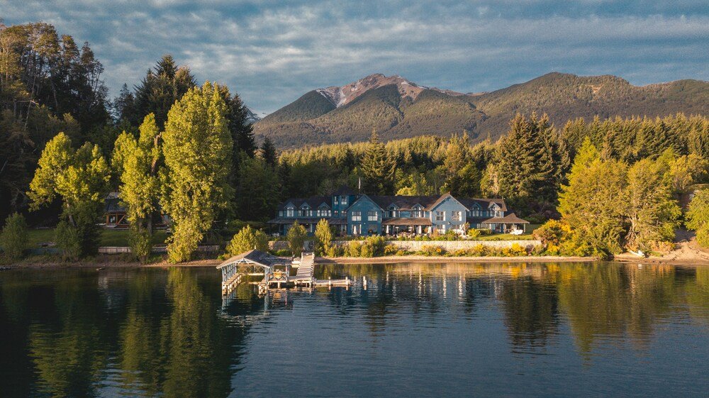 Lakeside lodge with multiple buildings at Las Balsas