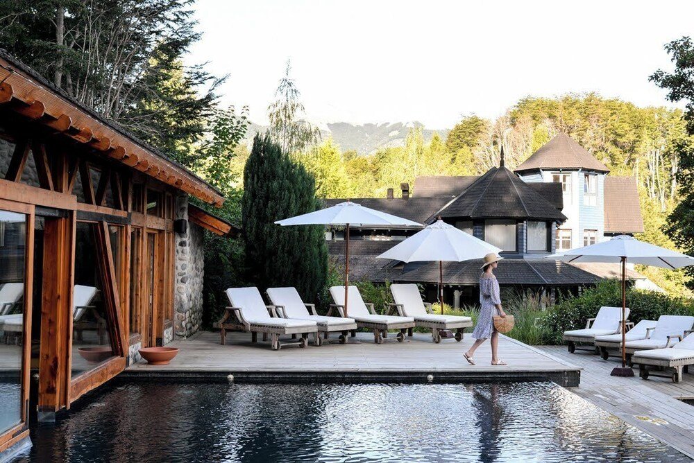 Poolside area with lounge chairs at Las Balsas