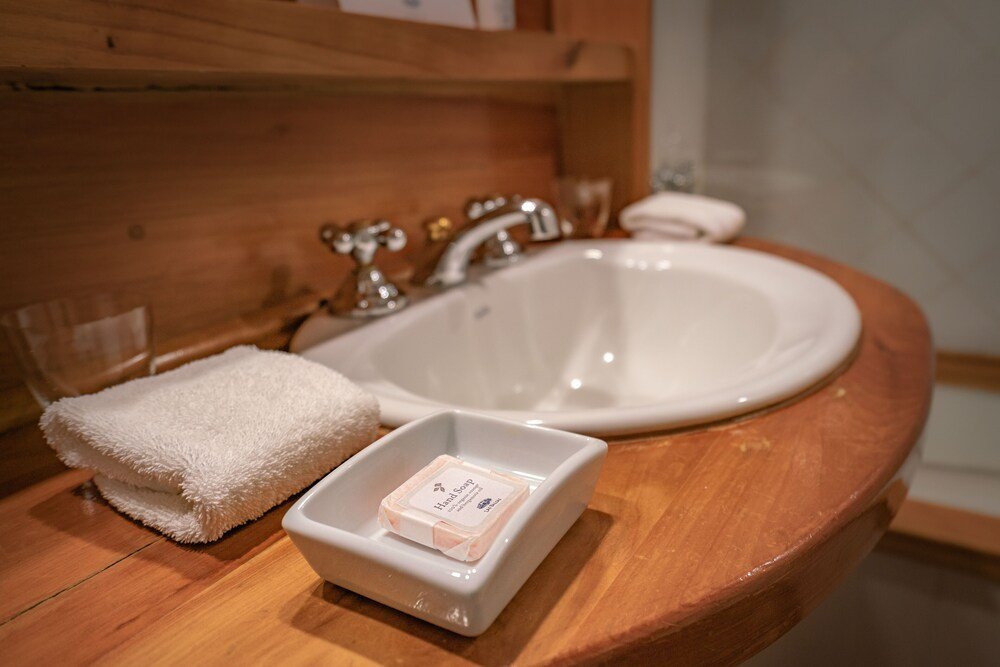 Bathroom with a wooden vanity at Las Balsas