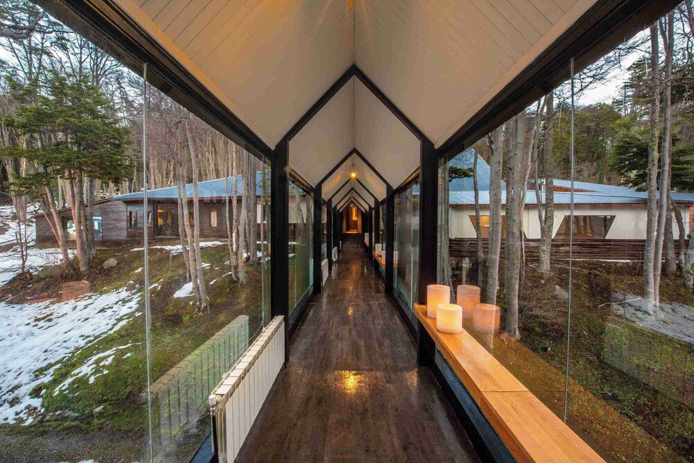 Corridor with glass walls and wooden flooring