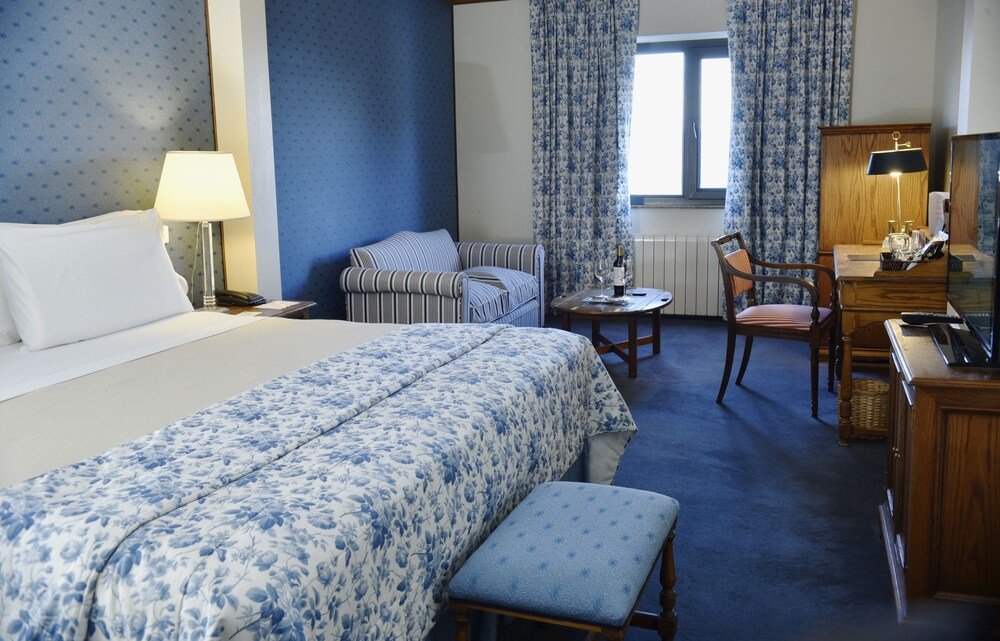 Hotel room with a bed and desk