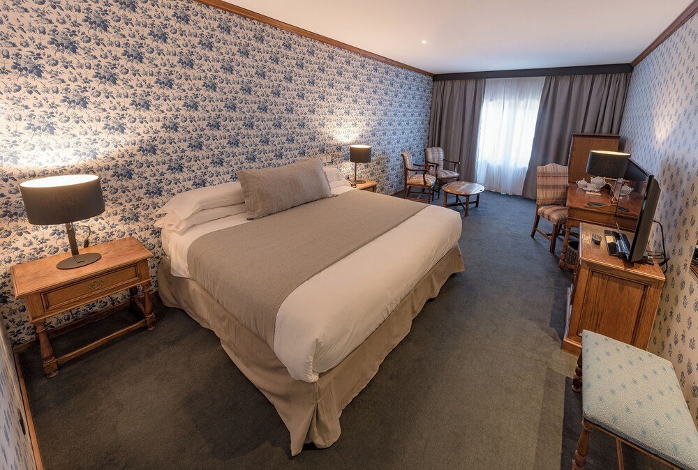 Hotel room with a large bed and bedside tables